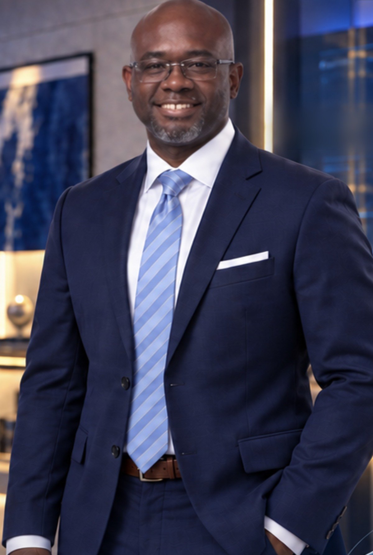 Dr. Eugene Harris III, MD, in a navy suit