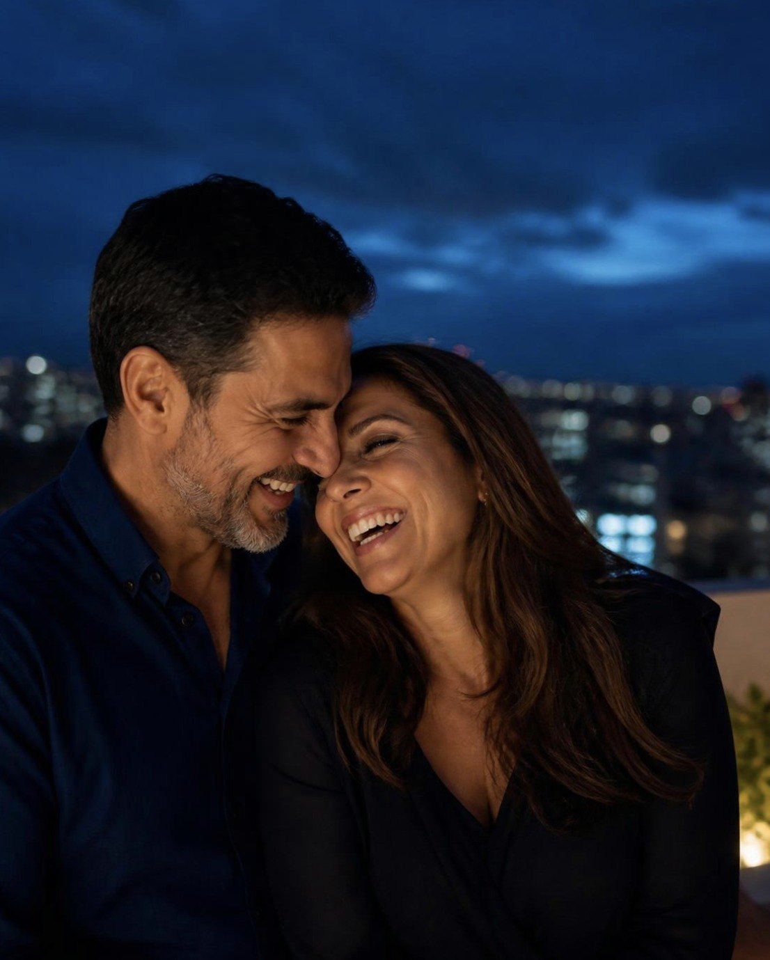 Smiling couple embracing at night